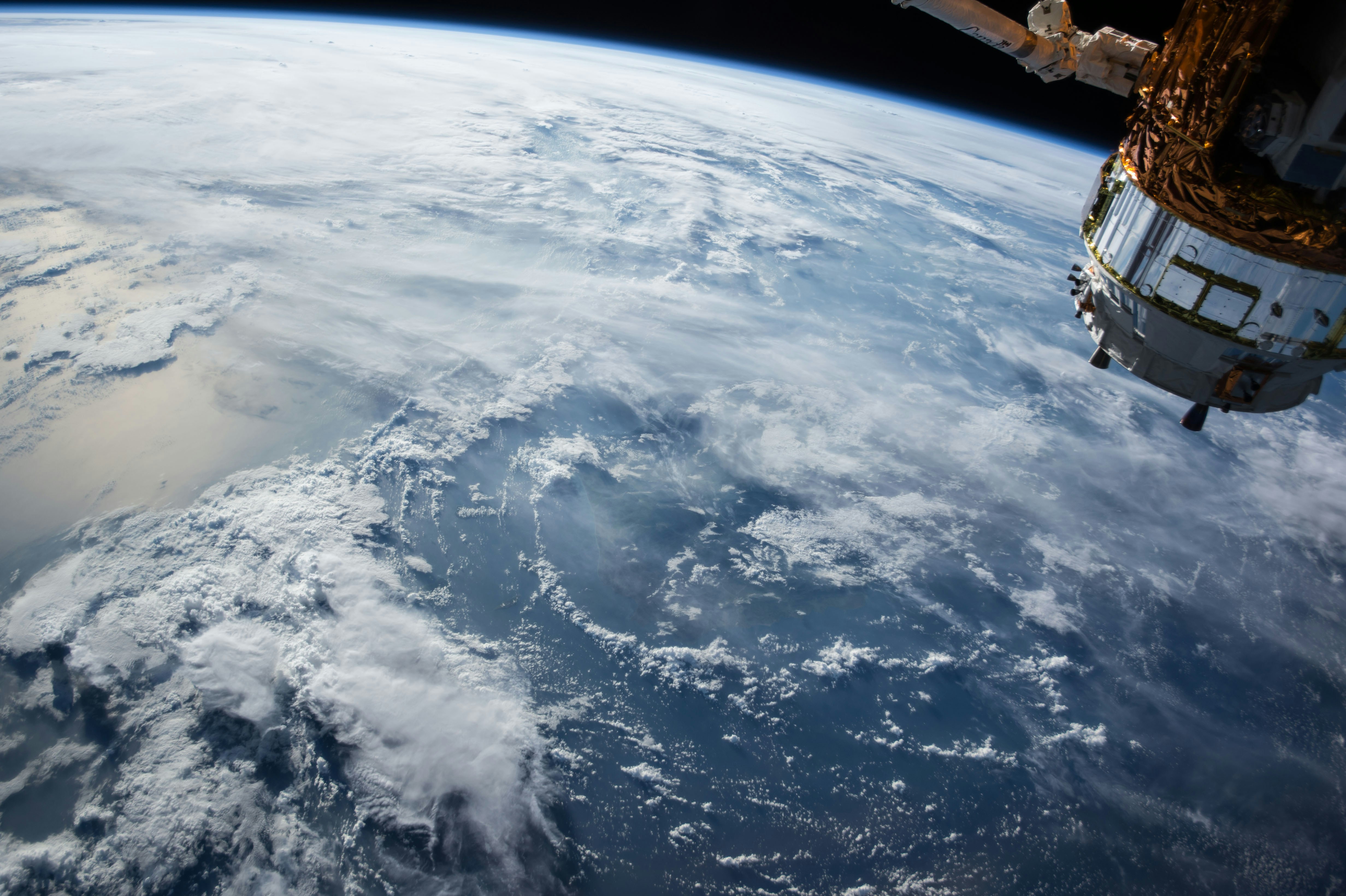 View of Earth from space showing satellite, representing comprehensive job search perspective